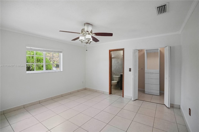 unfurnished bedroom featuring visible vents, baseboards, a ceiling fan, and ornamental molding