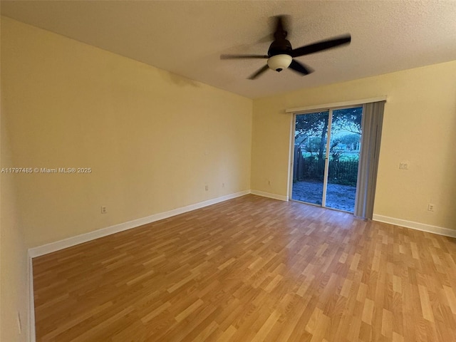 8706 Blaze Ct, Davie, FL 33328 - unfurnished room with a ceiling fan, wood finished floors, baseboards, and a textured ceiling
