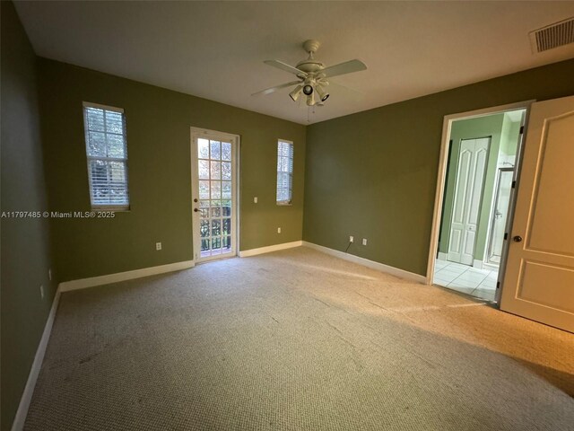 8706 Blaze Ct, Davie, FL 33328 - empty room with baseboards, light colored carpet, and ceiling fan