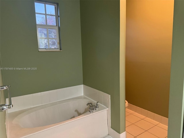 8706 Blaze Ct, Davie, FL 33328 - bathroom with a garden tub, toilet, and tile patterned flooring