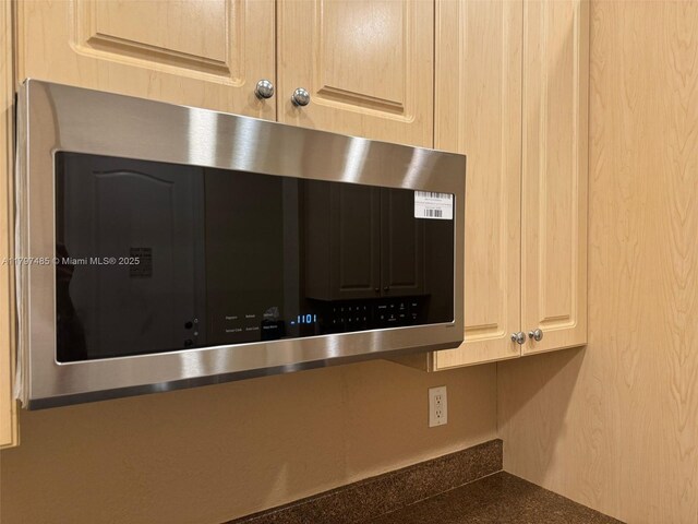 8706 Blaze Ct, Davie, FL 33328 - detailed view of stainless steel microwave and dark countertops