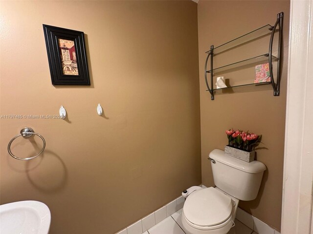 8706 Blaze Ct, Davie, FL 33328 - bathroom with toilet, baseboards, and tile patterned floors
