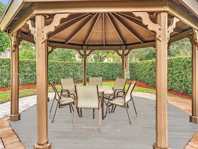 8706 Blaze Ct, Davie, FL 33328 - wooden terrace featuring a gazebo, outdoor dining area, and a fenced backyard