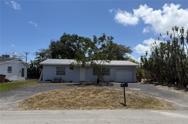 660 SW 14th Pl, Deerfield Beach, FL 33441 - ranch-style home with a front lawn, stucco siding, driveway, and a garage