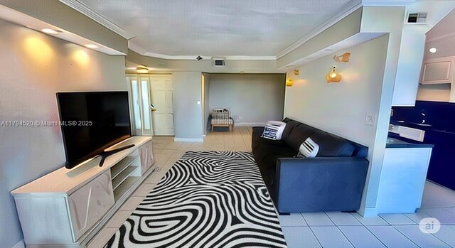 1500 N Ocean Blvd Unit 502, Pompano Beach, FL 33062 - living room featuring light tile patterned flooring and ornamental molding