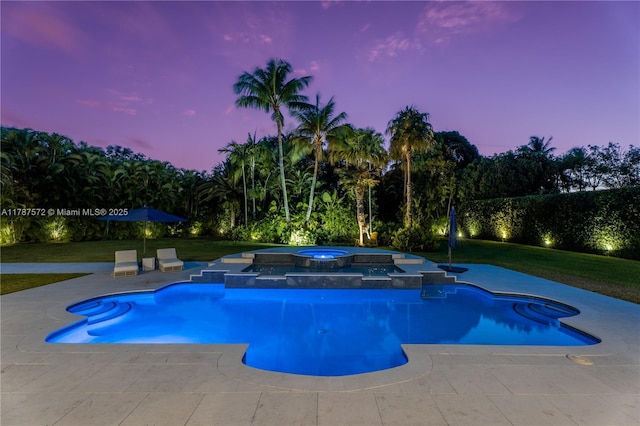 10120 SW 72nd Ave, Pinecrest, FL 33156 - pool at dusk featuring a yard, a pool with connected hot tub, and a patio area