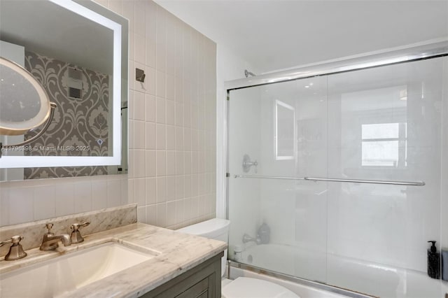 770 Claughton Island Dr Unit 1114, Miami, FL 33131 - bathroom with tile walls, vanity, and shower / bath combination with glass door