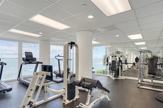 770 Claughton Island Dr Unit 1114, Miami, FL 33131 - gym with plenty of natural light, a paneled ceiling, and a water view