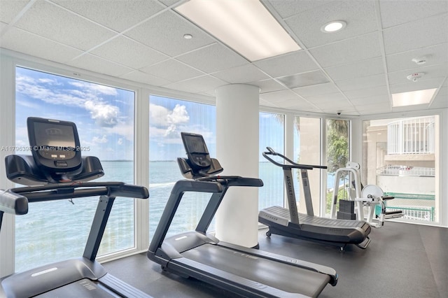 770 Claughton Island Dr Unit 1114, Miami, FL 33131 - exercise room featuring expansive windows, a paneled ceiling, and a water view
