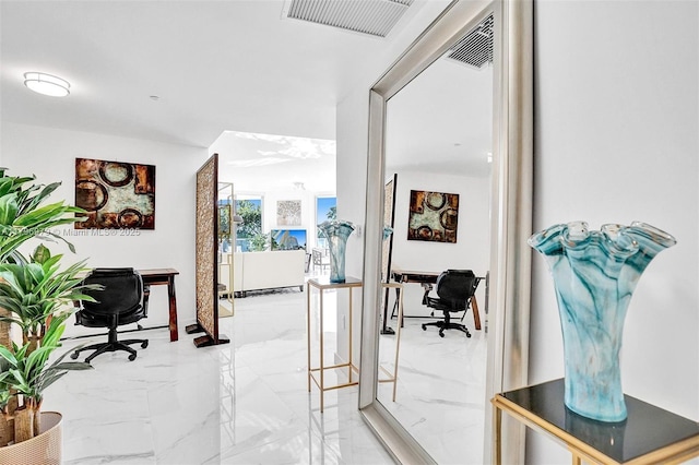 488 NE 18th St Unit 208, Miami, FL 33132 - hallway featuring light marble finish flooring and an office area
