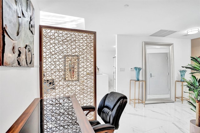 office area featuring visible vents and marble finish floor