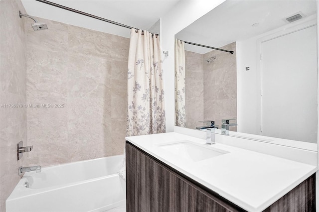 full bathroom featuring shower / tub combo with curtain, vanity, and visible vents