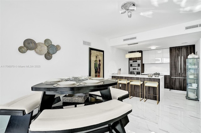 488 NE 18th St Unit 208, Miami, FL 33132 - dining room with light marble finish flooring