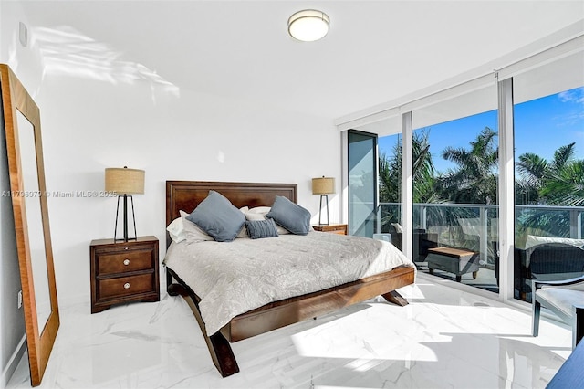 bedroom with a wall of windows, access to outside, and marble finish floor