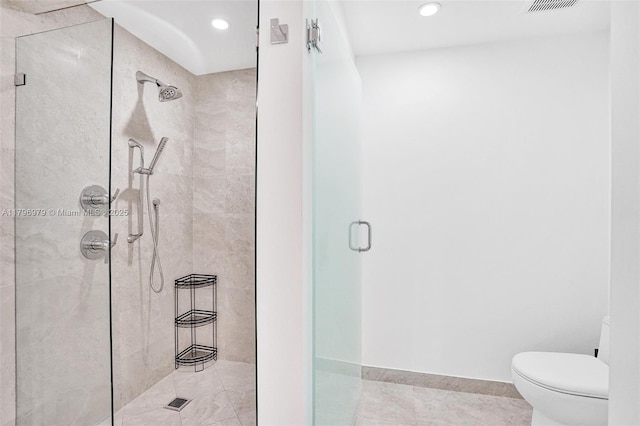 full bathroom with a stall shower, toilet, tile patterned floors, and recessed lighting