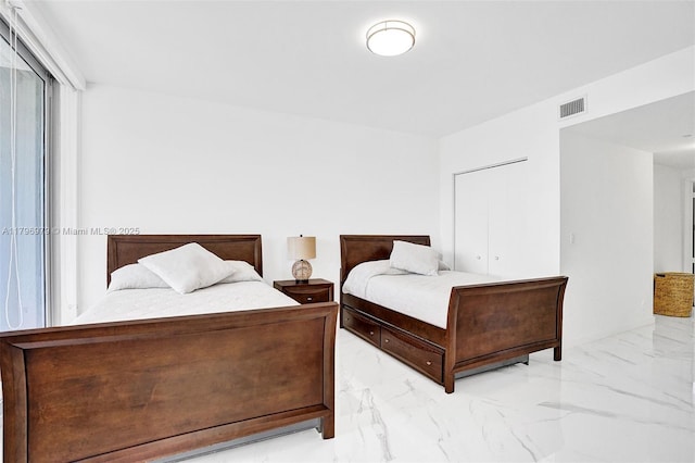 bedroom featuring marble finish floor and visible vents