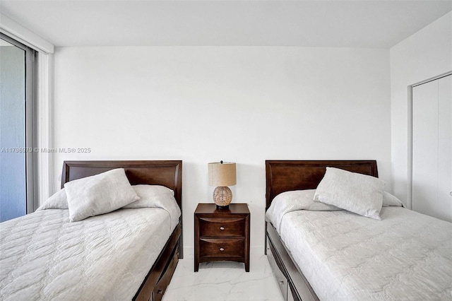 488 NE 18th St Unit 208, Miami, FL 33132 - bedroom featuring light marble finish floors and a closet