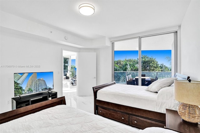 bedroom with marble finish floor and multiple windows