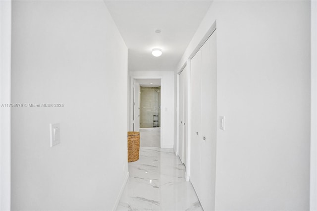 488 NE 18th St Unit 208, Miami, FL 33132 - hall with light marble finish flooring and baseboards