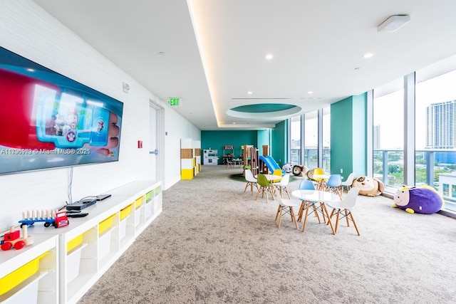 488 NE 18th St Unit 208, Miami, FL 33132 - playroom featuring carpet flooring, floor to ceiling windows, and recessed lighting