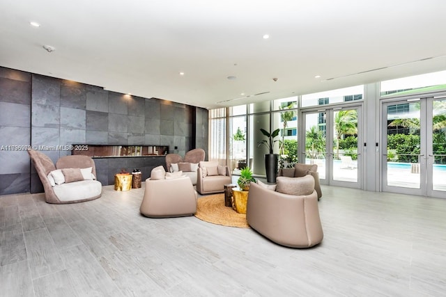 488 NE 18th St Unit 208, Miami, FL 33132 - common area featuring recessed lighting and a wall of windows