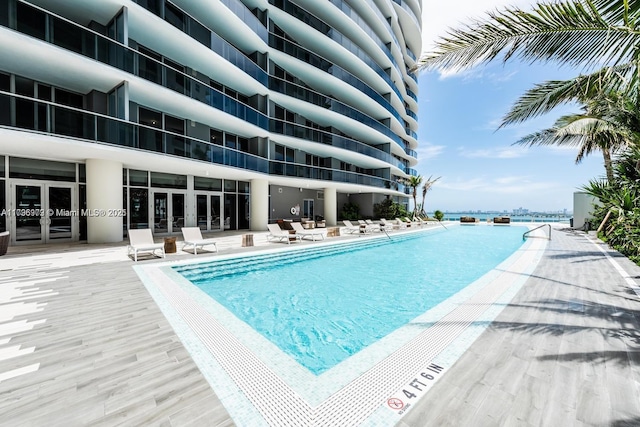 488 NE 18th St Unit 208, Miami, FL 33132 - community pool with french doors and a patio area