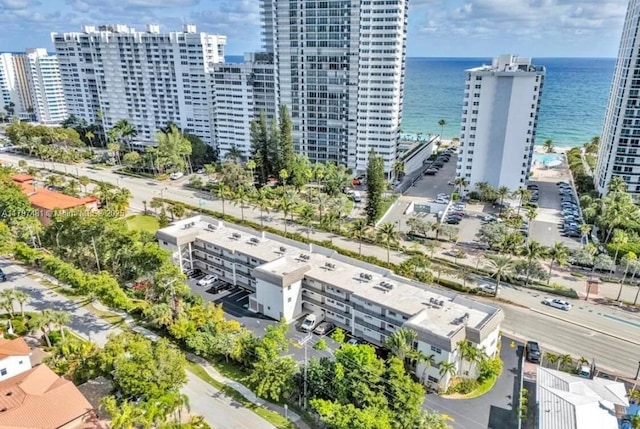 aerial view featuring a water view and a view of city