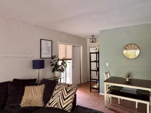 living room with tile patterned floors