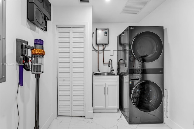 13211 SW 6th St, Miami, FL 33184 - clothes washing area with stacked washer / dryer, marble finish floor, visible vents, a sink, and cabinet space