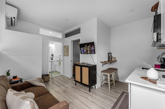 13211 SW 6th St, Miami, FL 33184 - living area with baseboards, light wood-style floors, a wall mounted air conditioner, and recessed lighting