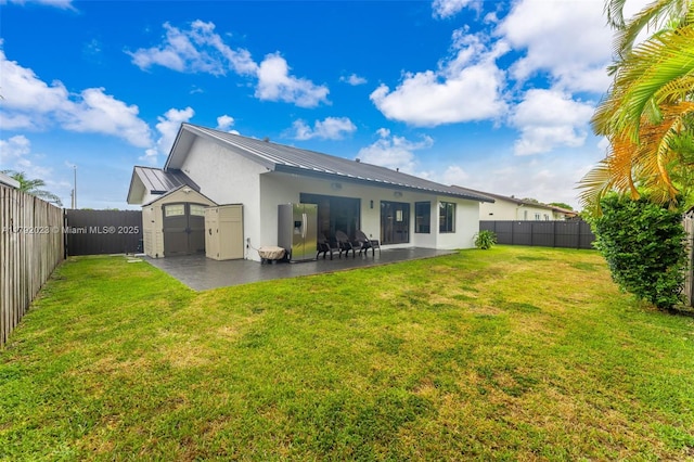 13211 SW 6th St, Miami, FL 33184 - back of house with a storage shed, stucco siding, a fenced backyard, and a patio