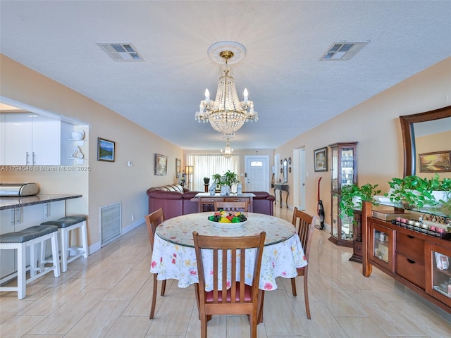 104 N 31st Ct, Hollywood, FL 33021 - dining room featuring an inviting chandelier, baseboards, and visible vents