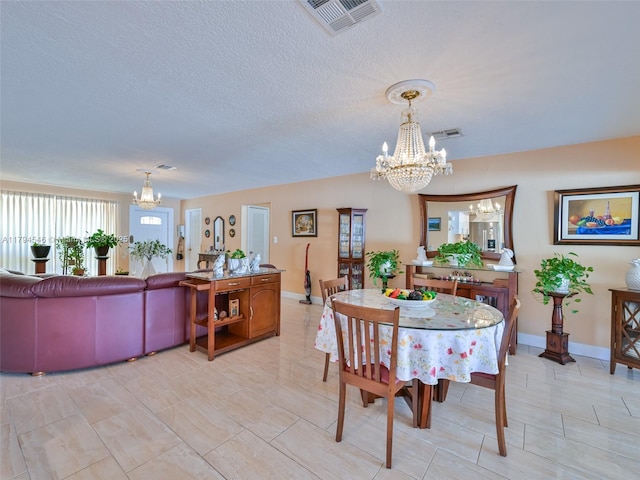 104 N 31st Ct, Hollywood, FL 33021 - dining area featuring a notable chandelier, baseboards, and visible vents