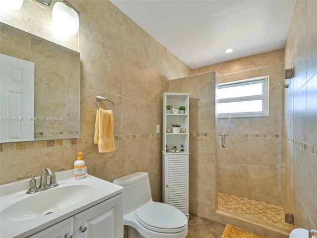 104 N 31st Ct, Hollywood, FL 33021 - bathroom featuring a stall shower, tile walls, vanity, and toilet