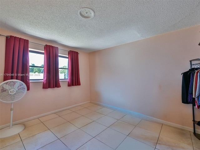 104 N 31st Ct, Hollywood, FL 33021 - unfurnished room with baseboards, tile patterned flooring, and a textured ceiling