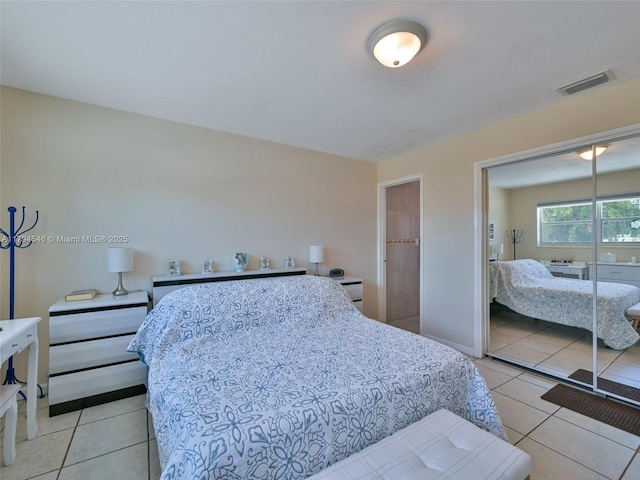 104 N 31st Ct, Hollywood, FL 33021 - bedroom with light tile patterned floors, baseboards, a closet, and visible vents