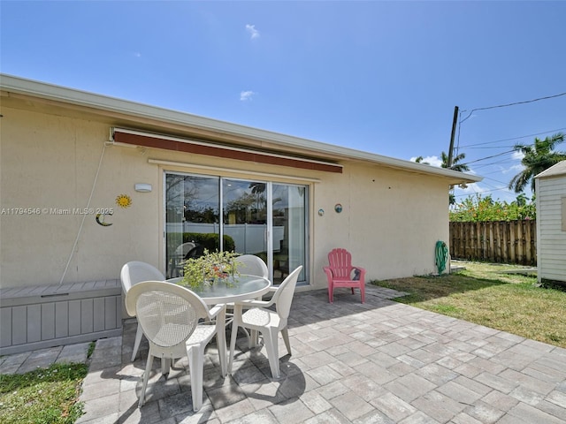 104 N 31st Ct, Hollywood, FL 33021 - view of patio / terrace featuring fence and outdoor dining space