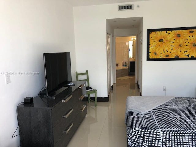 bedroom with visible vents and tile patterned floors