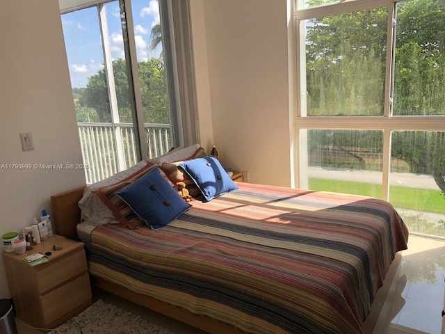 bedroom with multiple windows