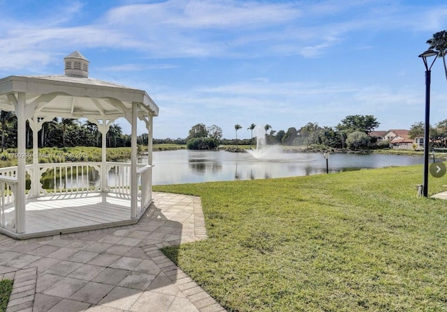 view of yard featuring a water view and a gazebo