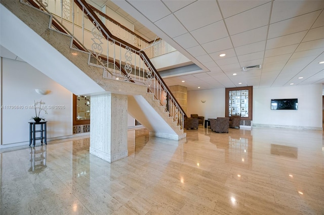 2899 Collins Ave Unit 1738, Miami Beach, FL 33140 - unfurnished living room with stairs, baseboards, and recessed lighting