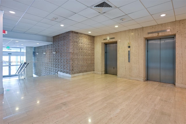 2899 Collins Ave Unit 1738, Miami Beach, FL 33140 - unfurnished room with elevator, a paneled ceiling, recessed lighting, and french doors
