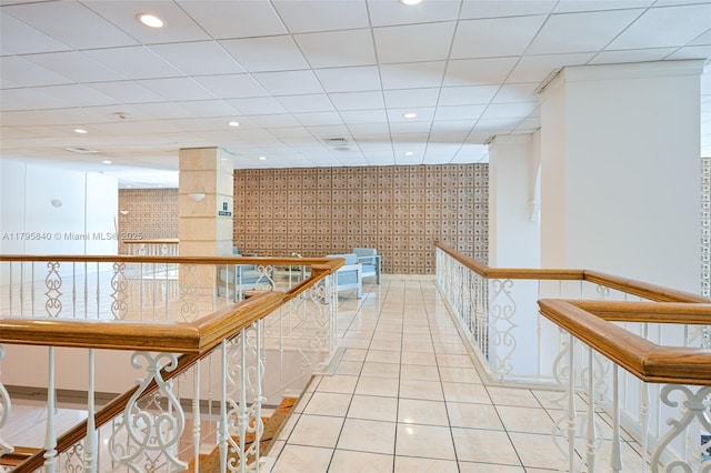 2899 Collins Ave Unit 1738, Miami Beach, FL 33140 - hallway featuring wallpapered walls, an upstairs landing, recessed lighting, and tile patterned flooring