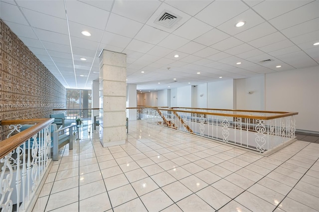 2899 Collins Ave Unit 1738, Miami Beach, FL 33140 - corridor with tile patterned flooring, recessed lighting, and an upstairs landing