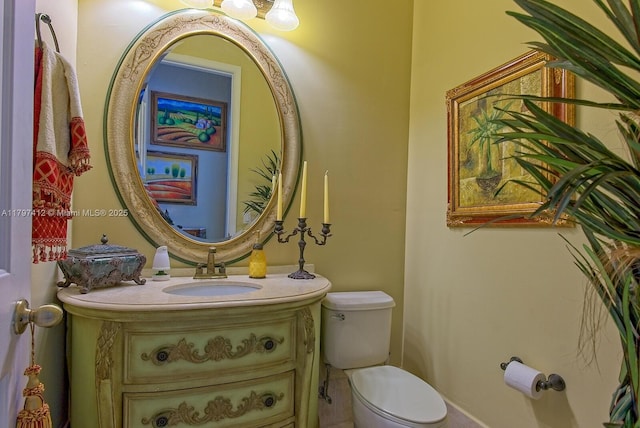 half bath featuring toilet and vanity