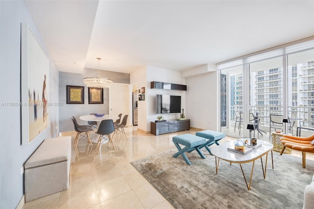 living area with expansive windows, a notable chandelier, baseboards, and light tile patterned floors
