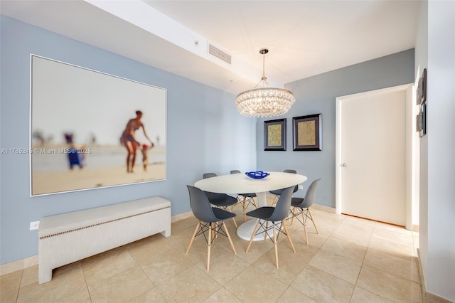 dining room featuring light tile patterned flooring, a notable chandelier, baseboards, and visible vents