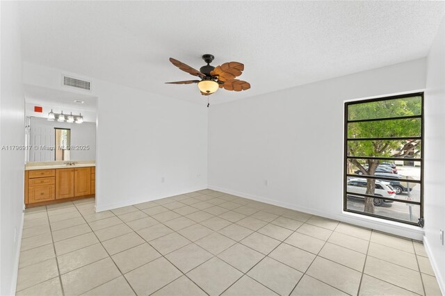 9040 SW 125th Ave Unit D202, Miami, FL 33186 - spare room featuring light tile patterned floors, visible vents, and a ceiling fan