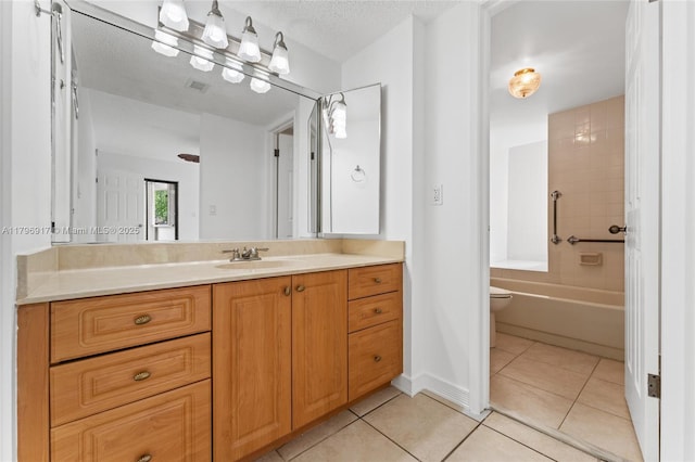 full bath with a textured ceiling, toilet, visible vents, tile patterned flooring, and vanity