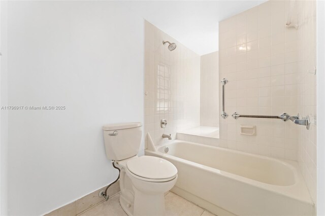 9040 SW 125th Ave Unit D202, Miami, FL 33186 - bathroom featuring toilet, tub / shower combination, tile patterned flooring, and baseboards